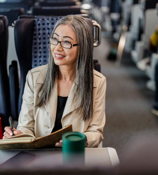 Passenger loading a bike onto an Amtrak Venture Car