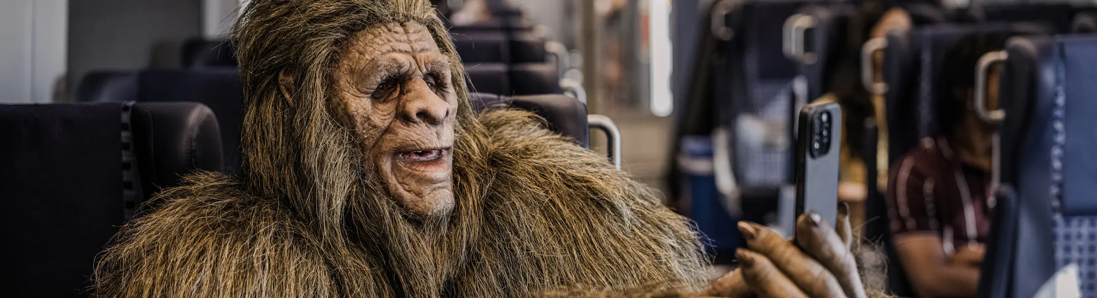 Photo of Bigfoot holding a smartphone, apparently enjoying the free WiFi on Gold Runner.